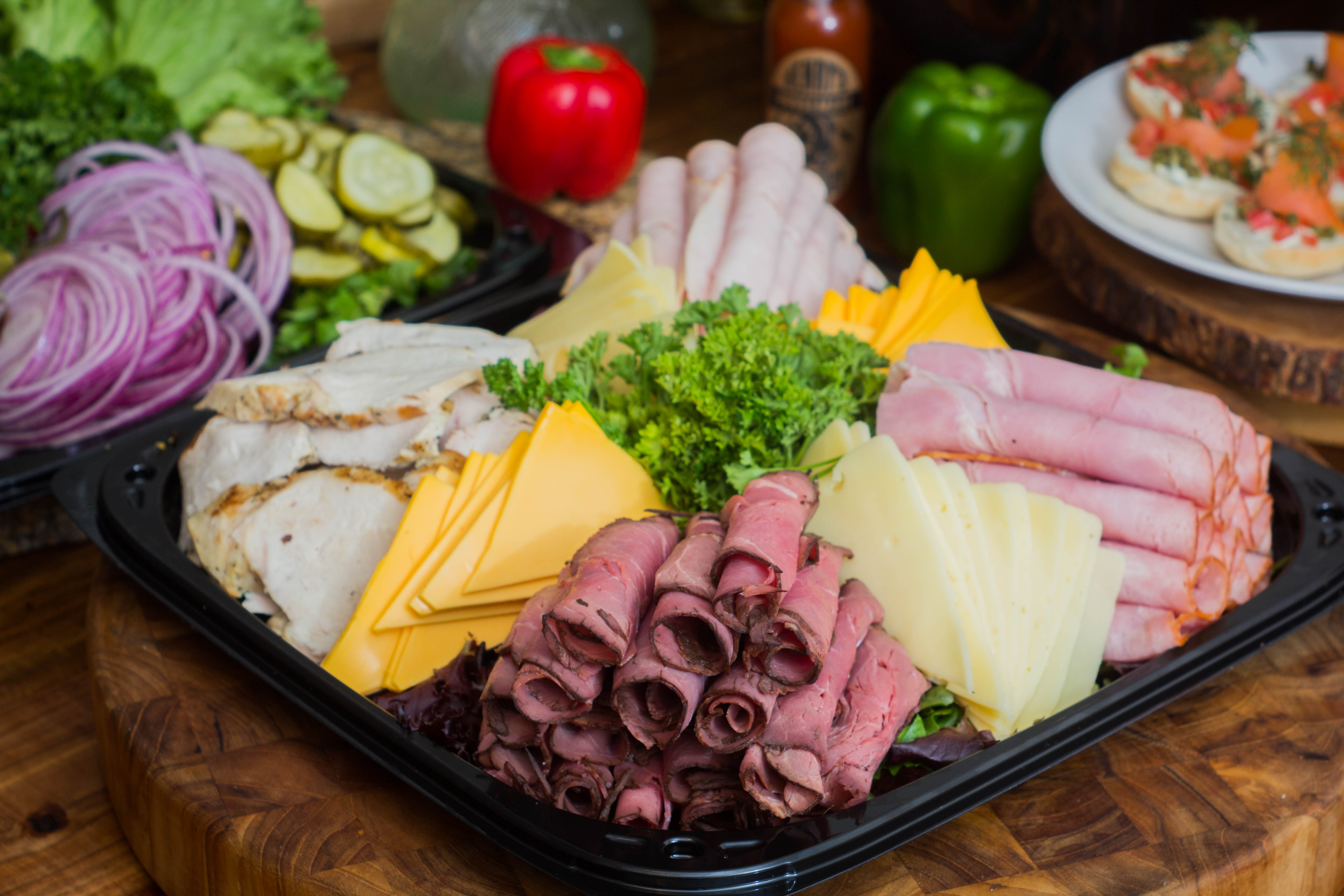 Deli platter with roast beef, ham, turkey and cheeses